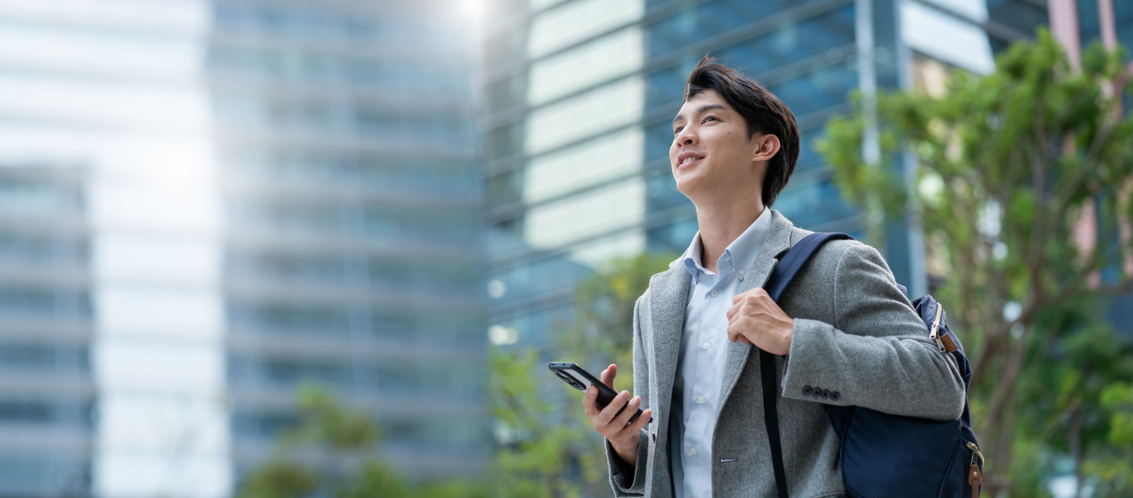 A professional walking outdoors between meetings