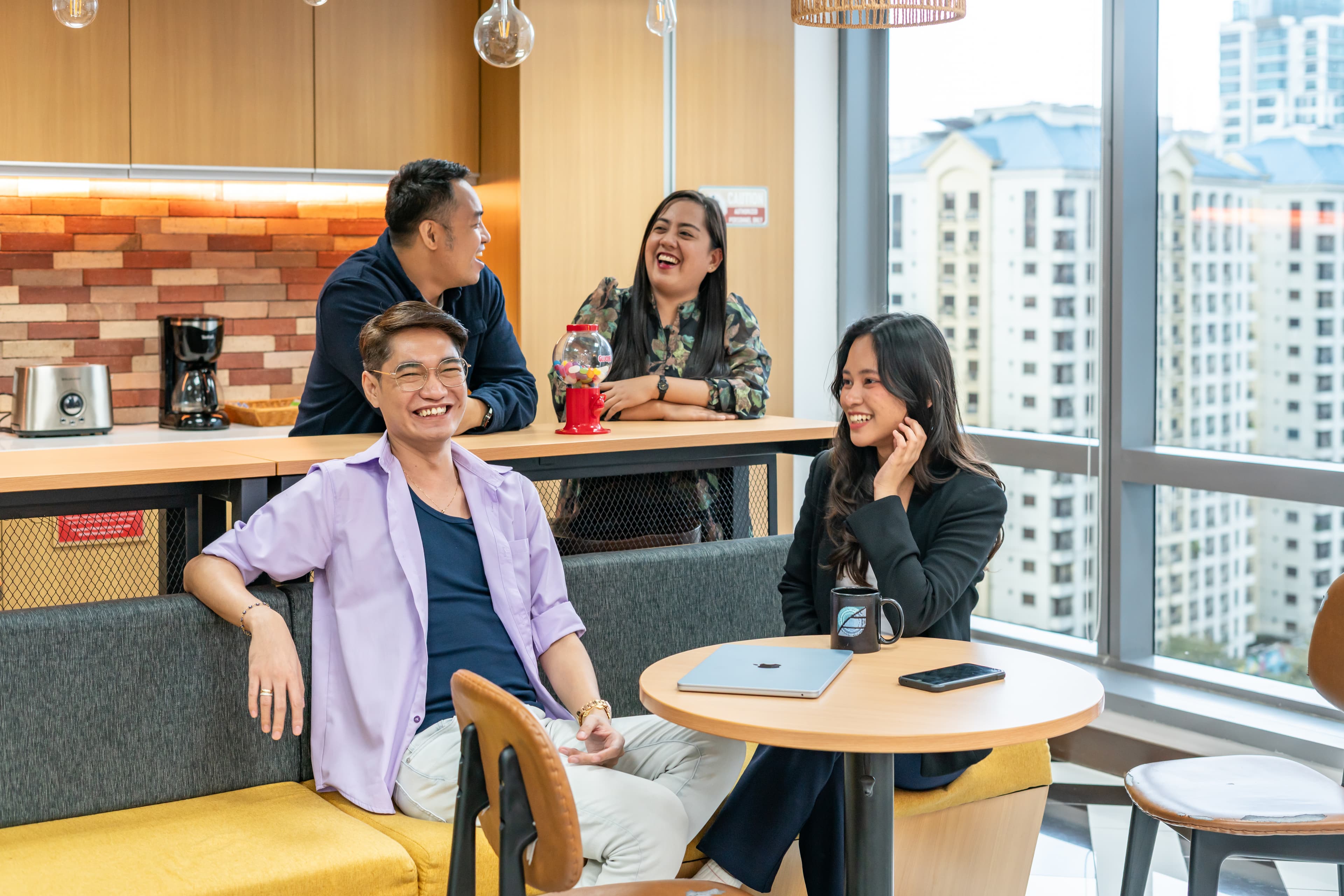 Colleagues talking together in a breakout space